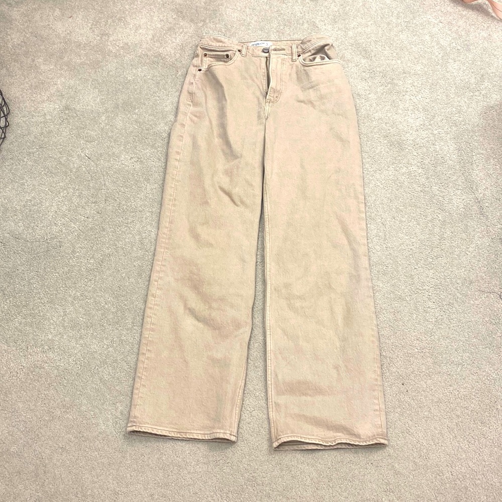 Beige straight leg jeans.